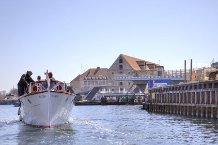 DENMARK, COPENHAGEN - May 03.2013: Swimming on a channel cutter and bridge constructionのeditorial素材