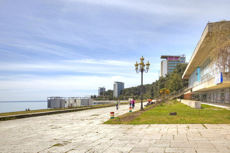 PITSUNDA, ABKHAZIA - April 26.2015: Sanatorium-resort complex ashore the Black sea. The city beach and promenade climatic resortのeditorial素材