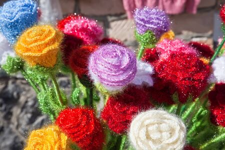 Artificial flowers knitted from woolen threadsの写真素材