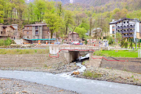 SOCHI, KRASNAYA POLYANA, RUSSIA - April 29.2015: Settlement of municipal type  Krasnaya Polyana and the river Mzymtaのeditorial素材