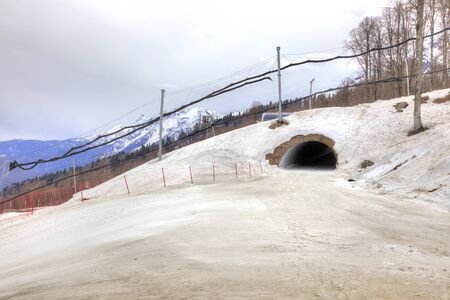 Road tunnel under the ski route on a mountain slope Plateau Rosaの写真素材
