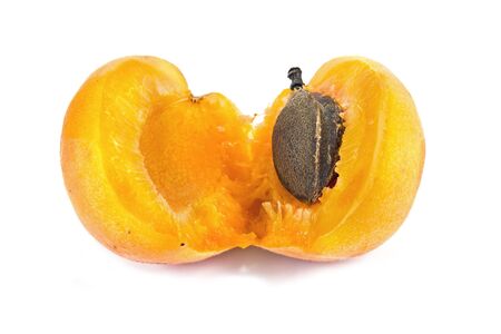Two lobules of apricot isolated on a white background