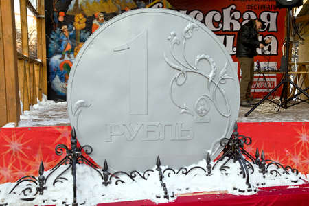 MOSCOW, RUSSIA - January 01.2010: Sceneries. Stylized ruble coin. Preparing for a festive concert Ruble on stageのeditorial素材