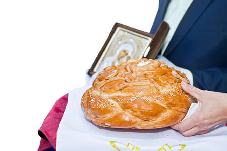 Tradition meets the newlyweds with bread and salt. Bread, salt and icon. It is isolated, background whiteの写真素材