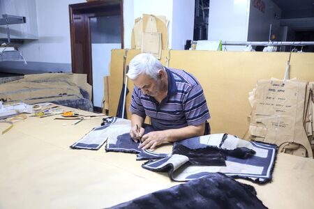 GREECE, KASTORIA - March 12.2016: Workshop on sewing female fur coats on a factory