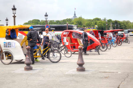 PARIS, FRANCE - April 30.2014: Trishaw waiting of customers on the Place de la Concorde