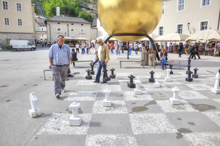 SALZBURG, AUSTRIA - May 05.2012: Citizens play chess on Kapitelplatz Squareのeditorial素材