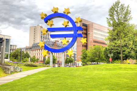 FRANKFURT AM MAIN, GERMANY - May 07.2014: Sculpture as a logotype of Euro is set in a public garden...