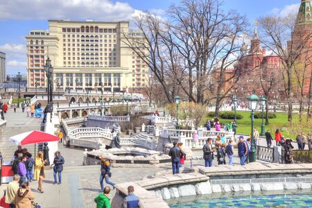 MOSCOW, RUSSIA - April 24.2016: People walk past the Alexander Garden fountains in the historic center of cityのeditorial素材