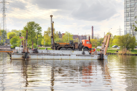 KALININGRAD, RUSSIA - April 28.2018: Drill rig on a barge in the middle of the Pregolya Riverのeditorial素材