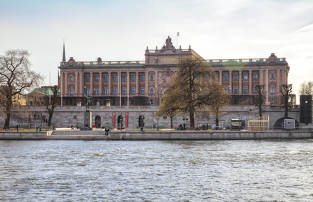 STOCKHOLM, SWEDEN - May 04.2013: Riksdag, the Swedish parliament ashore bay in the historic center of the cityの写真素材