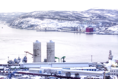 Sea boats and tugboats moored in the city cargo port in the Kola Bay of the Barents Seaのeditorial素材