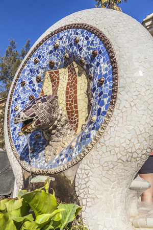 SPAIN, BARCELONA - May 05.2014: Park Guell in Barcelona, Spain. Park was designed by Gaudi and built in 1900 to 1914. Small fountain in the form of a reptile's headのeditorial素材