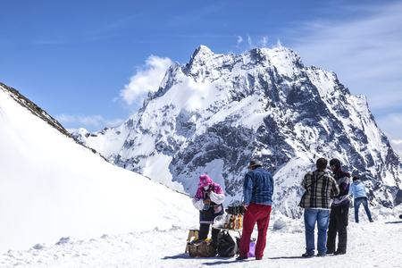 DOMBAY, RUSSIA - May 03.2015: Tourists buy drinks at the top of the mountain in the climate ski resort Dombayのeditorial素材