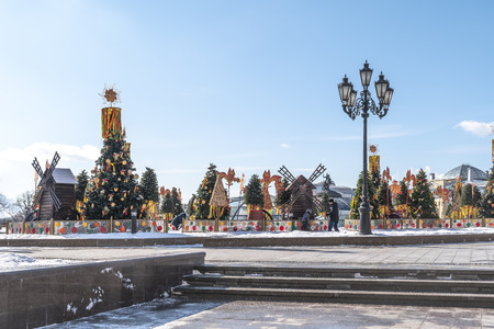 MOSCOW, RUSSIA - March 02.2019: Holiday Maslenitsa. A variety of decorative holiday buildings and decorations on Manezhnaya Squareのeditorial素材