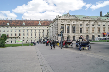 VIENNA, AUSTRIA - May 04.2011: A carriage on Heldenplatz square near the royal residence of the Hofburg. Walk through the historic center of the city on a real carriageのeditorial素材