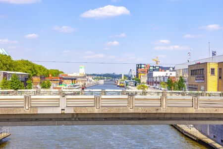 BRUSSELS, BELGIUM - May 02.2011: Bridge over the canal in the industrial part of the cityの写真素材