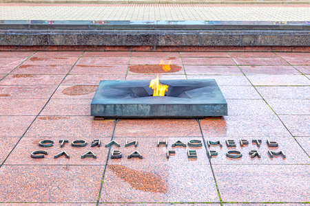 Brest, Republic of Belarus - March 10.2020: Citadel. The eternal flame in the memorial complex Brest Fortress. The inscription next to the Eternal Flame - They stood to death, Glory to the heroesのeditorial素材