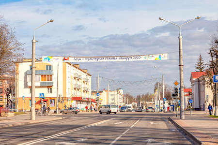 LIDA, REPUBLIC OF BELARUS - March 12.2020: Cityscape. Castle street in the historic city center. The inscription on the banner - Lida, the cultural capital of Belarusのeditorial素材