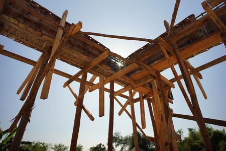 The wood support of the making reinforced steel concrete bar of the house under construction with the sunshine and clear sky in a hot day.の写真素材