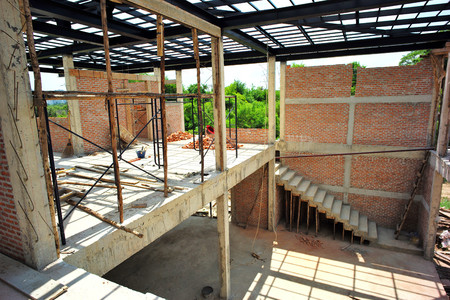 Workers installing bricklayer and plastering the cement texture on the wallのeditorial素材