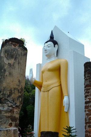 Standing Buddha statue  at the temple.の写真素材