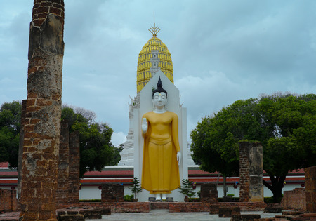 Standing Buddha statue  at the temple.の写真素材