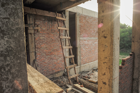 Texture and background of bricklayer and concrete wall at the house under constructionの写真素材