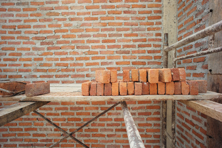 Texture and background of bricklayer and concrete wall at the house under constructionの写真素材