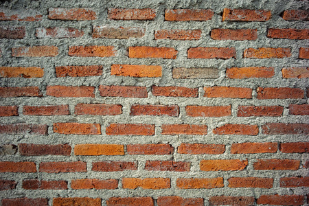 Abstract texture and background of red brick and bricklayer concrete wall at the house under constructionの写真素材