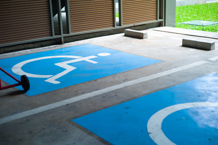 Sign and symbol of priority parking lots for the disable people. Reservation for wheelchair driver.の写真素材