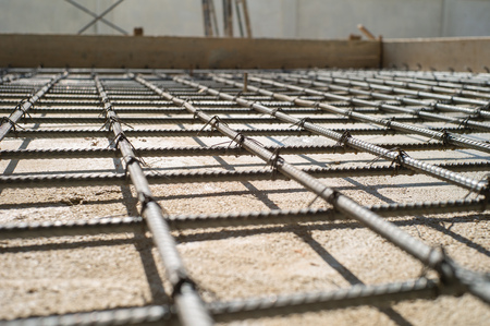 Closeup selective focus picture of steel line grid for reinforcement concrete structure
