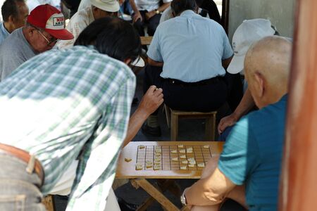 Nagasaki, Japan:August 31, 2016- Portrait crowd elder people playing Japanese chess at public park for hobby and meeting together. Activity for healing alzheimer syndom.のeditorial素材