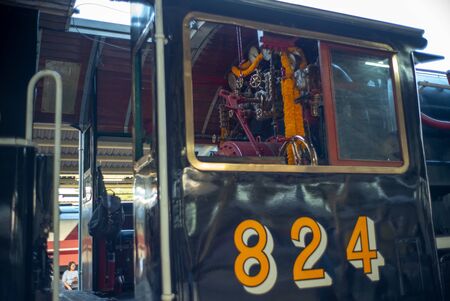 Bangkok,Thailand:December 5, 2018 - Closeup control and driver room of vintage steam train with...