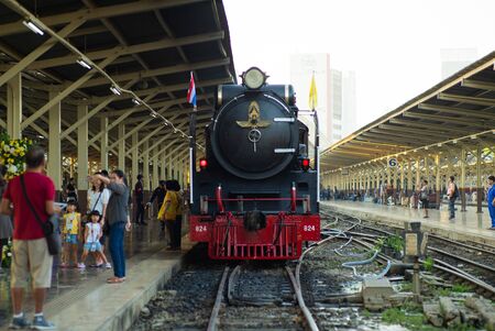 Bangkok,Thailand:December 5, 2018 - Closeup vintage steam train parking at the station waiting for departing. Crowd of people taking the picture with the trainのeditorial素材