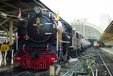 Bangkok,Thailand:December 5, 2018 - Closeup vintage steam train parking at the station waiting for departing. Crowd of people taking the picture with the train locomotiveのeditorial素材