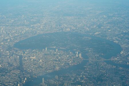 Aerial view of Bangkok, Thailand from airplane. Bird eyes view of the forest in middle of capital city.の写真素材