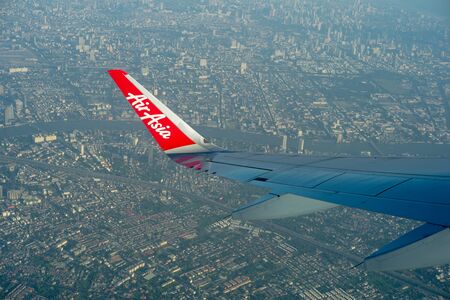 Bangkok, Thailand : December 19, 2019 - Top view crowd of cityscape looking down from Air Asia airplane while traveling in the skyのeditorial素材