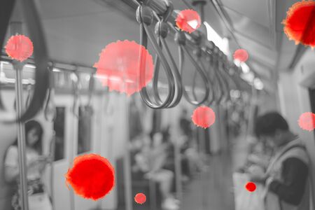 Selective focus on group of handrails inside the train with blurred passengers and bokeh lights in...