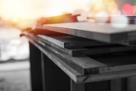 Selective focus on monochrome pile of wooden boards for installing the interior work at the construction siteの写真素材