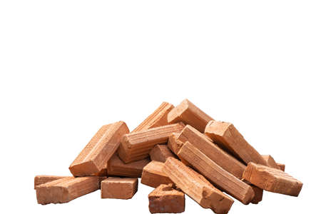 Closeup bulk of red brick at the construction site with blurred worker working in backgroundの写真素材