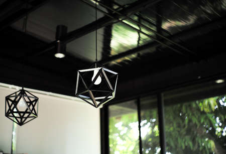 Closeup lamp in modern style hanging from the ceiling in the officeの写真素材