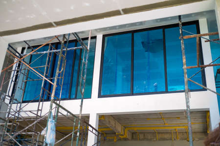 Perspective interior of house under construction with steel scaffolding insideの写真素材