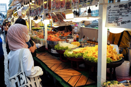 Bangkok, Thailand:March5,2023- Crowded of tourists walk and buy the delicious food in the street food fairのeditorial素材