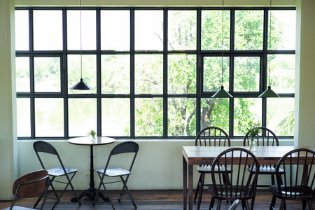 Interior perspective of coffee shop with wooden furnitures insideの写真素材