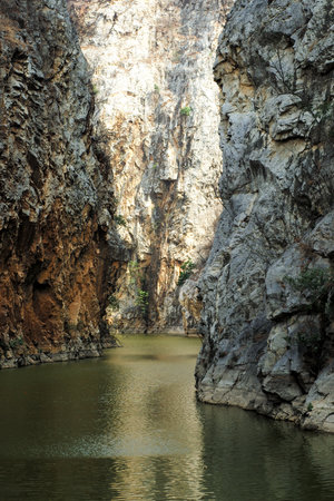 The layers of rocky cliff mountain with the lakeの写真素材