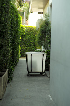 The cart carrying the new bed sheet and towel for making up the room in the hotel. Room service at the resortの写真素材