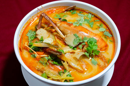 Top view closeup picture of famous Thai food called Tum Yum Kung. The big shrimp in the spicy soup.の写真素材
