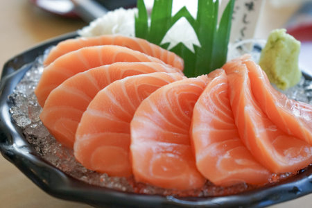 Closeup many pieces of raw fresh salmon in the bowl. Famous menu of Japanese foodの写真素材