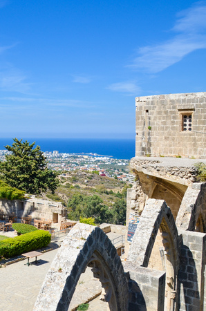 Bellapais, Cyprus - Oct 4th 2018: Vertical photo taken from the ruins of historical Bellapais Abbey. Amazing Mediterranean landscape and beautiful inner courtyard of the medieval monastery.のeditorial素材